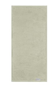 Een beige, rechthoekige badhanddoek met een klein stoffen label heeft een zachte, volle textuur en past perfect bij de Beddinghouse Care Handdoek Groen-set van drie.