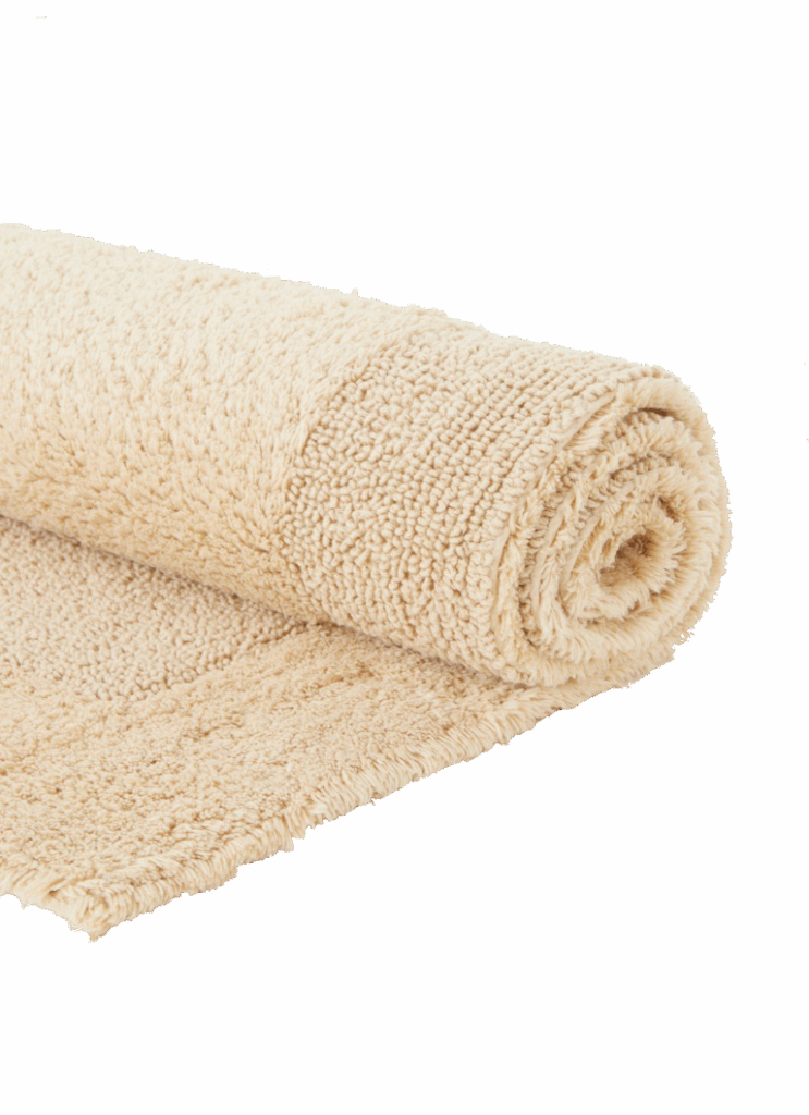Een close-up van de Vandyck Scala Luxury Badmat Beach laat de zachte, beige structuur en het luxe, comfortabele oppervlak zien.