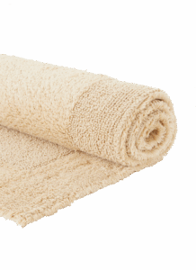 De Vandyck Scala Luxury Badmat Beach is een opgerolde beige badmat van zacht, gestructureerd materiaal.