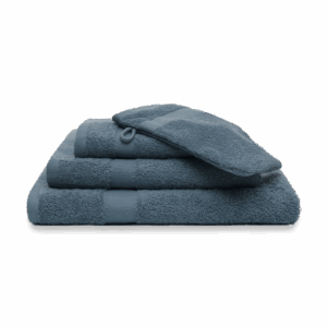 Een keurig stapeltje van zes Vandyck Prestige-gastendoekjes in de kleur Faded Denim, met het kleinste doekje bovenop.