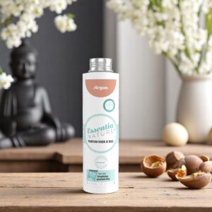 Essentia Wasparfum Argan 250 ml staat op een houten tafel tussen argannoten en witte bloemen, met een vage afbeelding van Boeddha op de achtergrond.